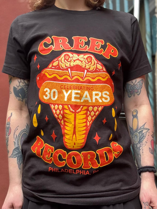 Person wearing a black t-shirt with 'Creep Records' graphic design celebrating 30 years.