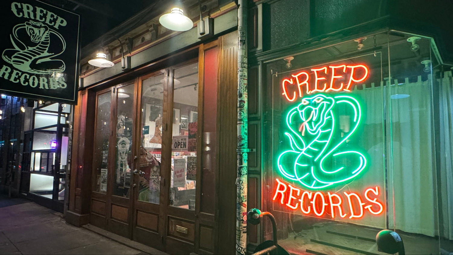 Creep Records' neon sign & Philadelphia storefront at night